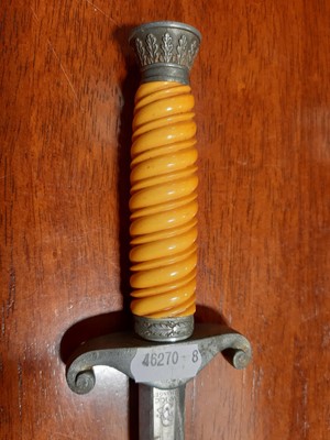 Lot 135 - Three replica German dress daggers and a replica socket bayonet