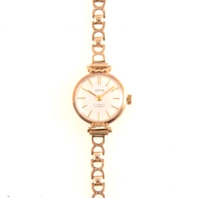 Lot 307 - Hefik - a lady's 9 carat gold bracelet watch.