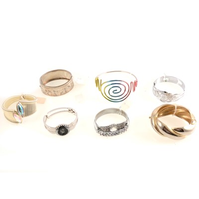 Lot 299 - Vintage white, bicolour and iridescent metal hinged bracelets.