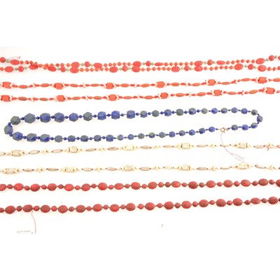 Lot 267 - Five Egyptian, Chinese influenced pressed glass bead necklaces.