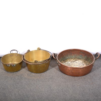 Lot 132 - Large circular copper pan; and three jam brass pans.