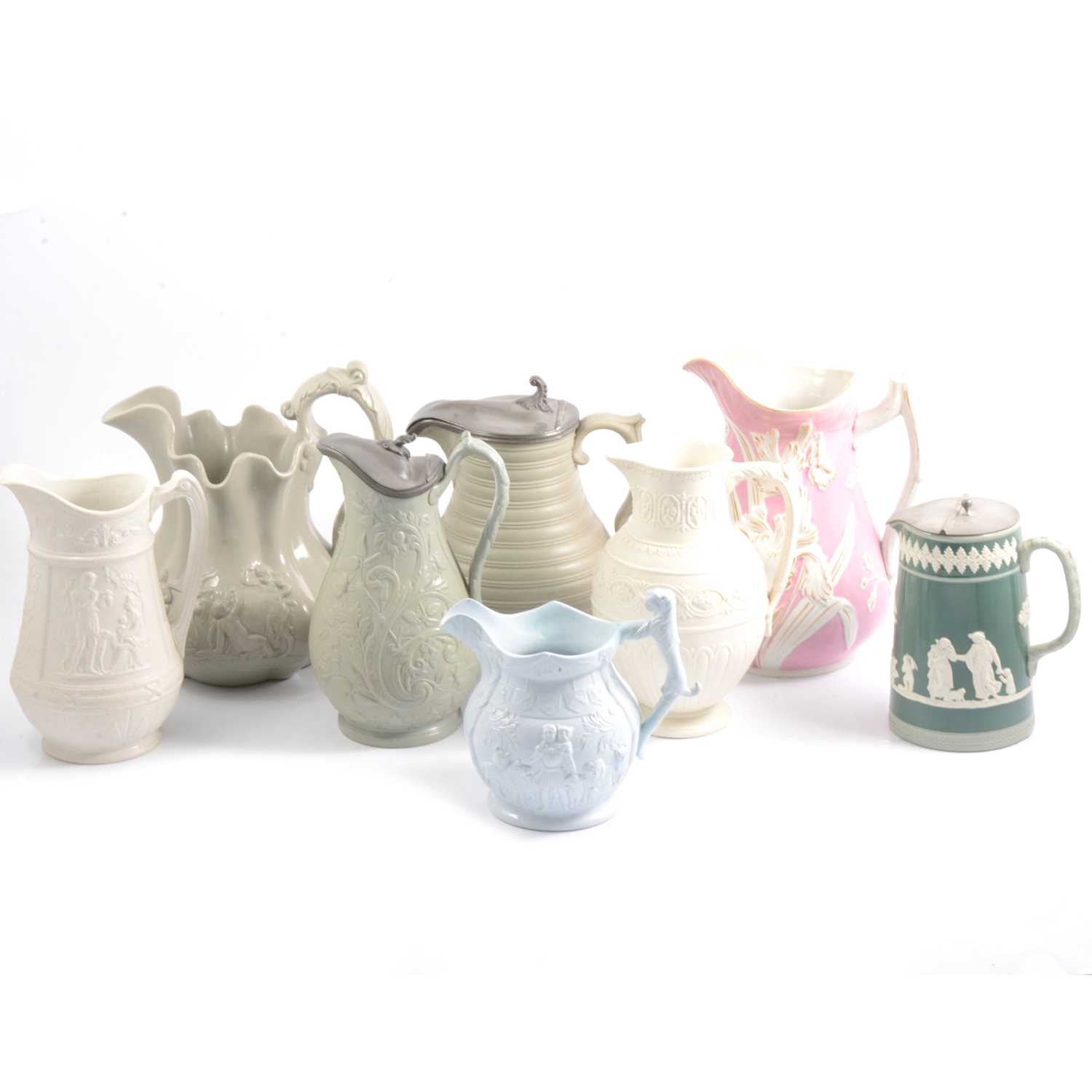 Lot 15 - Eight Victorian and later relief-moulded jugs.