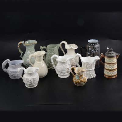 Lot 17 - Eleven Victorian relief-moulded jugs.