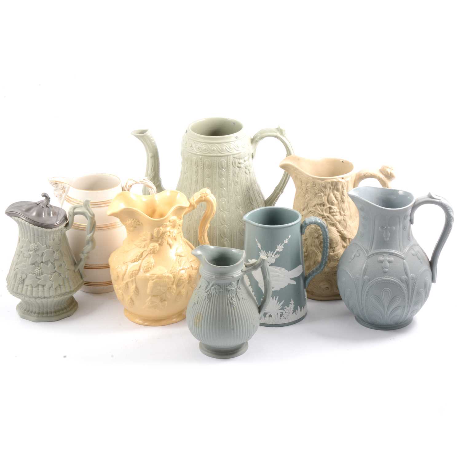 Lot 18 - Eight Victorian relief-moulded jugs.