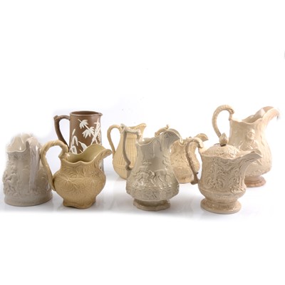 Lot 45 - Eight Victorian buff stoneware relief-moulded jugs.