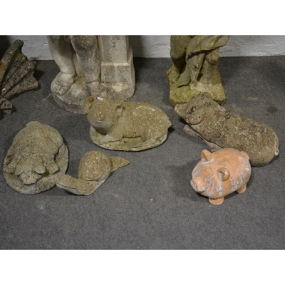 Lot 518 - Garden statues; four pigs, snail and a an urn base.