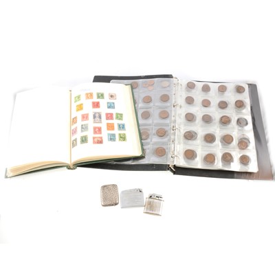 Lot 139 - An album of coins, albums of stamps, cigarette lighters and a silver vesta case.