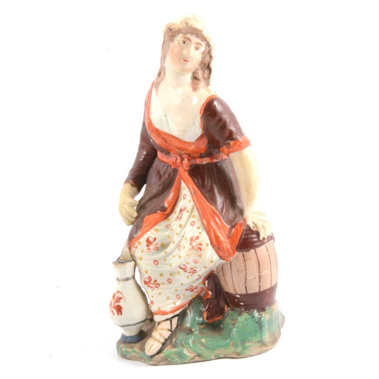 Lot 52 - Early Staffordshire pearlware figure, Washer Woman
