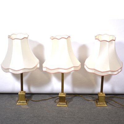 Lot 336 - Set of three brass table lamps