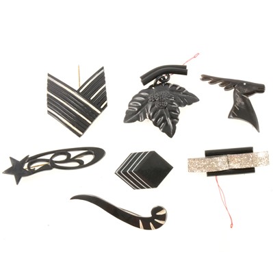 Lot 188 - Vintage 1940s and later black bakelite and celluloid brooches and pins.