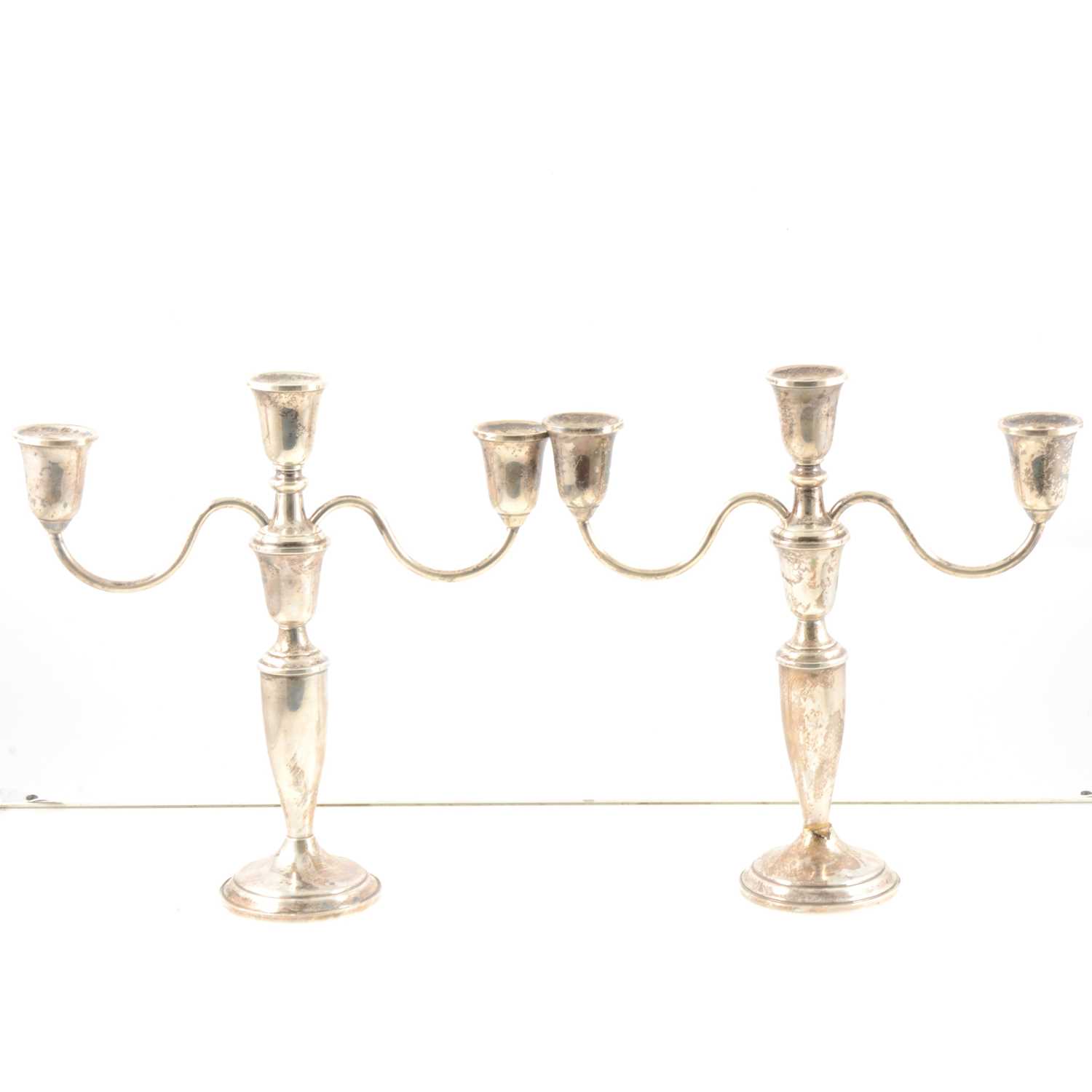 Lot 154 - Pair of American 'Towle Sterling' white metal three-arm candelabra.