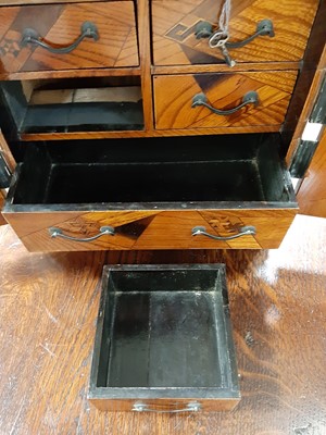 Lot 119 - Japanese inlaid table cabinet