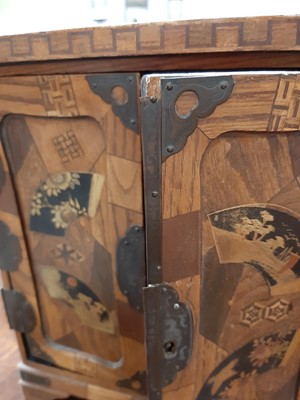 Lot 119 - Japanese inlaid table cabinet