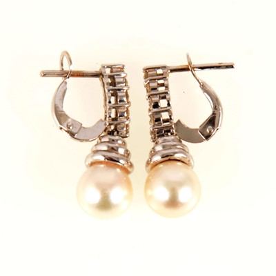 Lot 83 - A pair of pearl and diamond drop earrings.