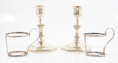 Lot 271 - Pair of George II style silver candlesticks and a pair of silver cup frames