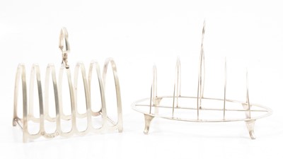 Lot 255 - Two silver toast racks