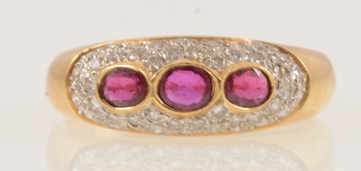 Lot 163 - A ruby and diamond dome shape ring.