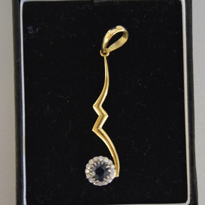 Lot 337 - A sapphire and diamond pendant.
