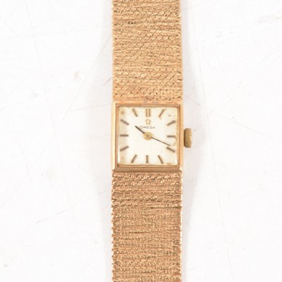 Lot 421 - Omega - A 9 carat yellow gold lady's bracelet watch.