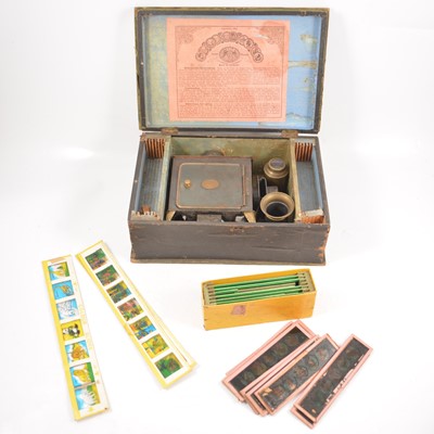 Lot 209 - Small German magic lantern with children's glass slides.