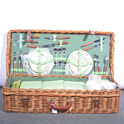 Lot 588 - A woven cane picnic basket, 80x40cm, fully fitted.