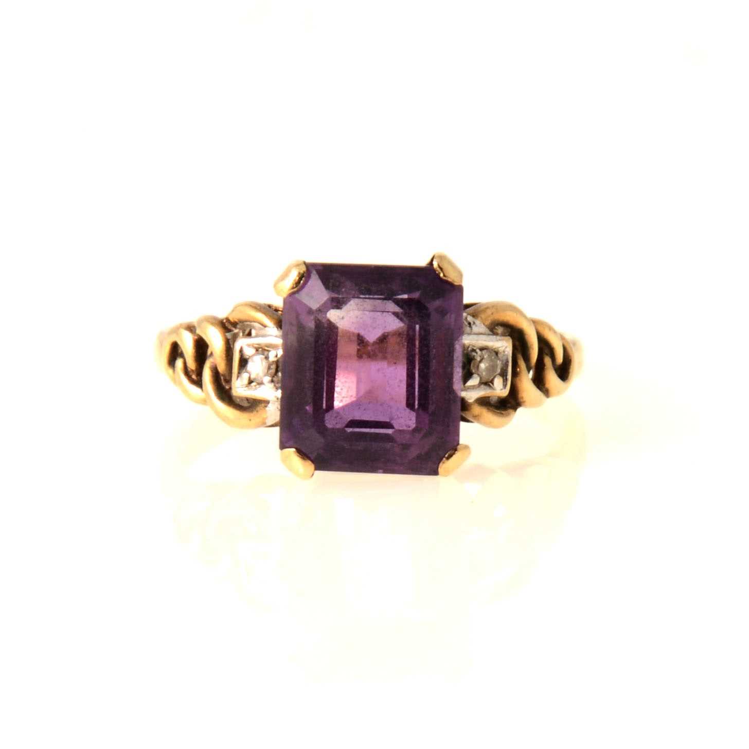 Lot 74 - An amethyst and diamond dress ring.