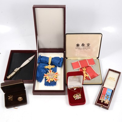 Lot 273 - An OBE, set of three WWII dress medals, silver handled paper knife by Grant MacDonald Silversmiths.