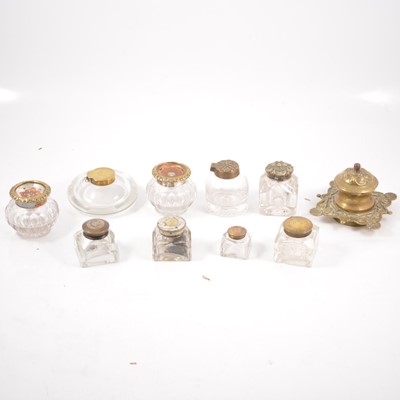 Lot 230 - Ten glass inkwells with brass and metal mounts.