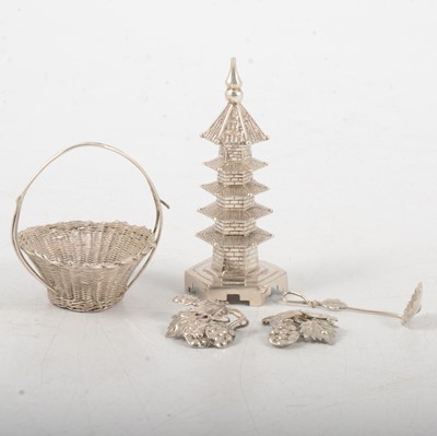 Lot 132 - Chinese white metal miniature pagoda pepperette, and filigree salt basket and spoon.