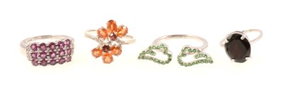 Lot 323 - Gemporia - Four garnet set rings.