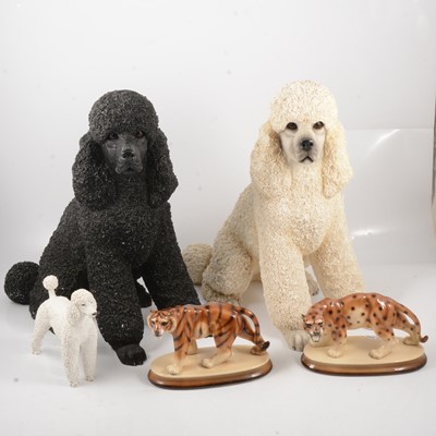 Lot 34 - Two large resin poodles, other poodle models and ornaments