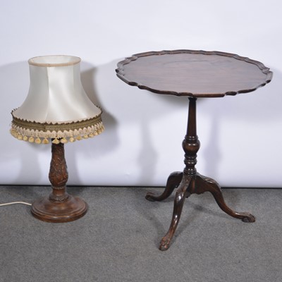 Lot 567 - Stained mahogany pedestal table, another adapted pedestal table, and a table lamp