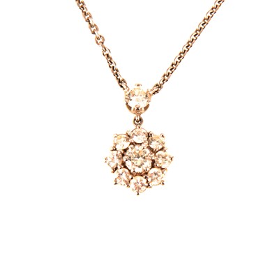 Lot 101 - A circular diamond cluster pendant and chain.