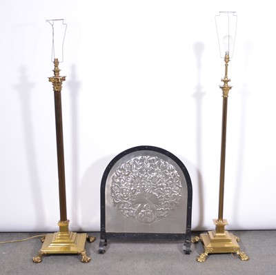 Lot 541 - Arts and Crafts steel panelled firescreen and two brass standard lamps