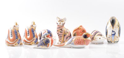 Lot 40 - Royal Crown Derby, ten animal paperweights and two Imari plates