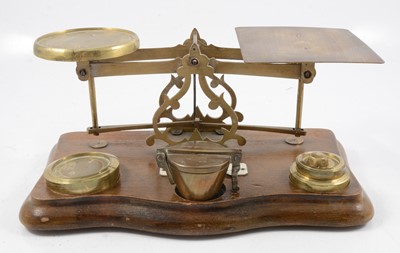 Lot 139 - Set of mahogany and brass postal scales and weights