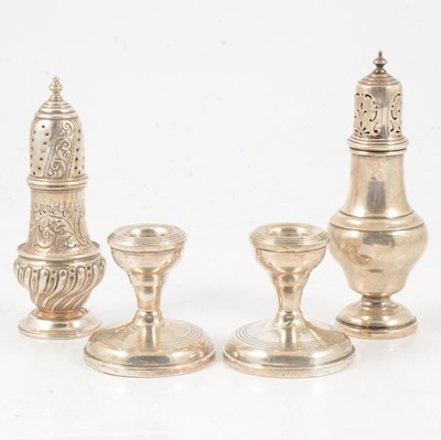 Lot 259 - Pair of silver dwarf candlesticks, W I Broadway & Co, Birmingham 1960, and two silver shakers.