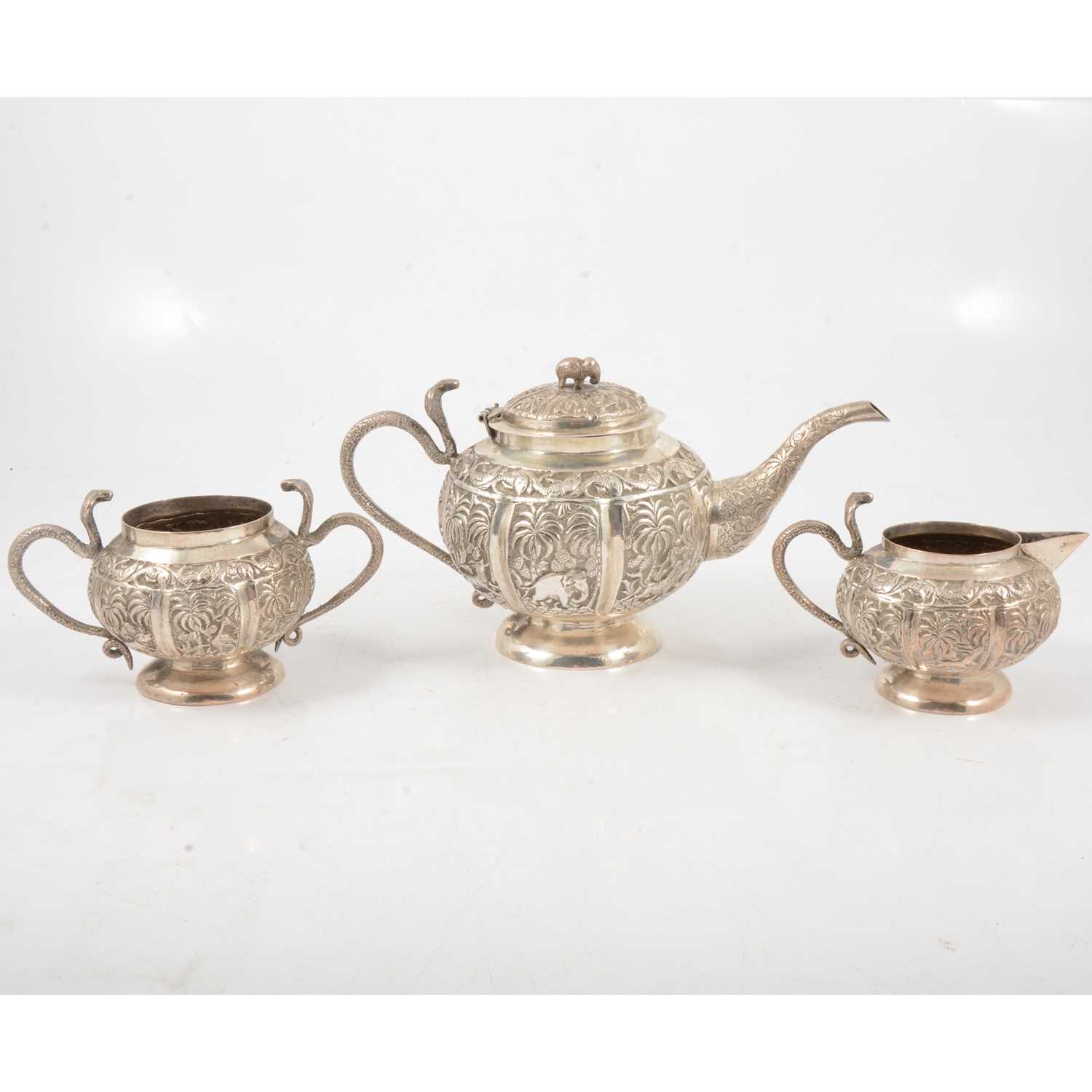 Lot 274 - An Indian silver-plated three piece teaset.