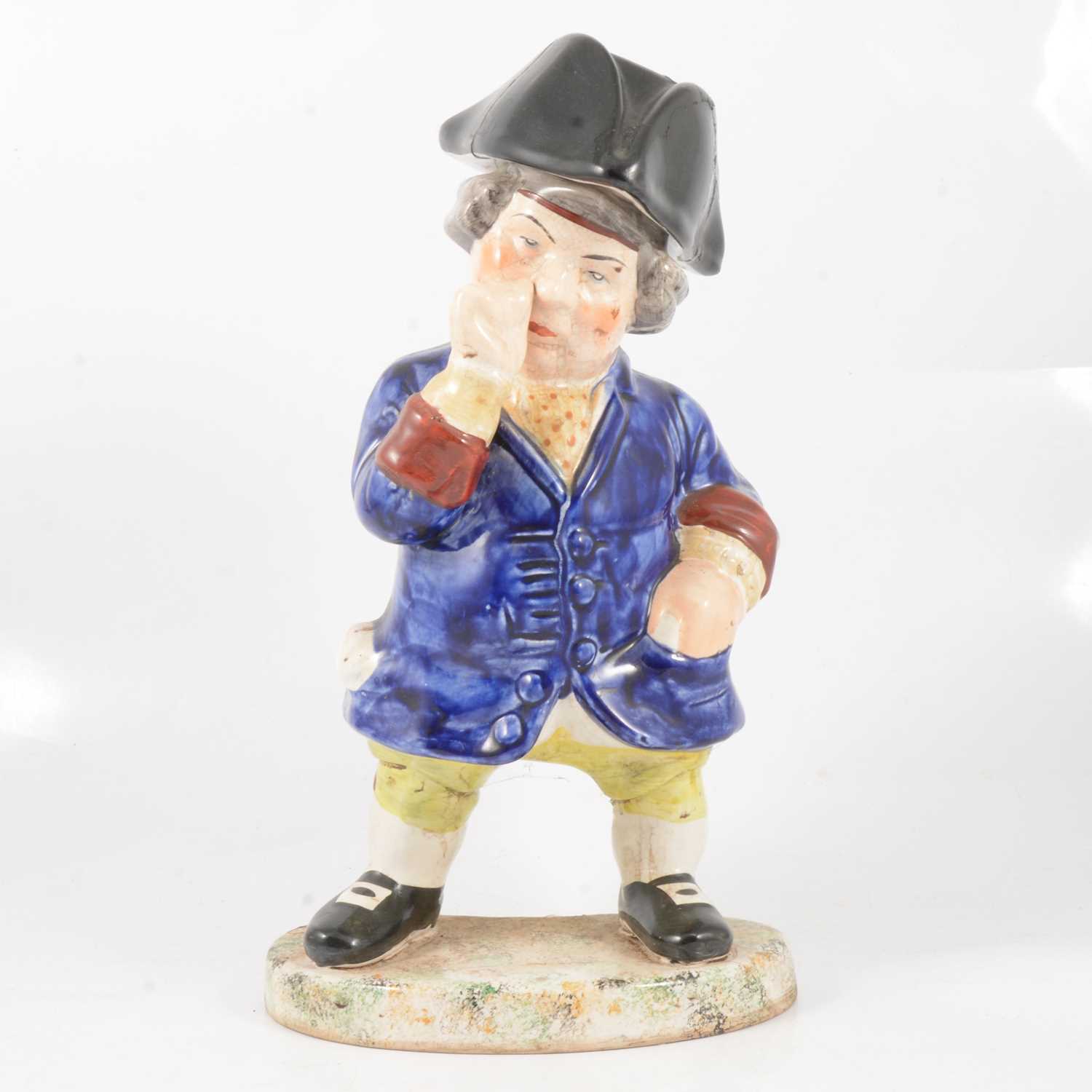 Lot 29 - A 19th century snuff taking standing man toby jug with hat.