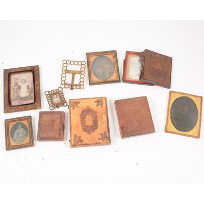 Lot 213 - A collection of daguerreotype and later portrait photographs in frames and folding cases.