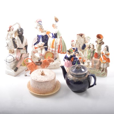 Lot 32 - A Victorian Staffordshire figure group, "Uncle Tom and Eva", 18cm and other figures.
