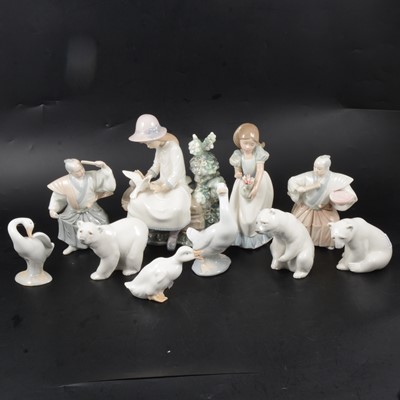 Lot 27 - Three Lladro polar bears, other Nao and similar Spanish figurines.