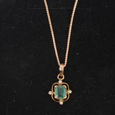 Lot 336 - An emerald and diamond pendant and chain.