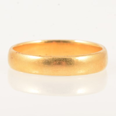 Lot 318 - A 22 carat yellow gold wedding band.