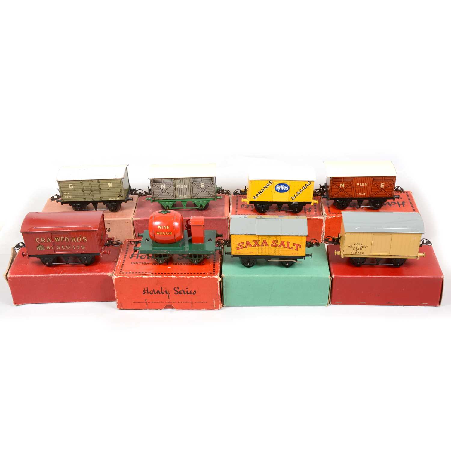 Lot 41 - Eight early Hornby O gauge model railway vans and rolling stock.