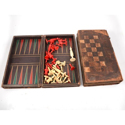 Lot 206 - A part set of ivory and stained red chess pieces and two games boxes.