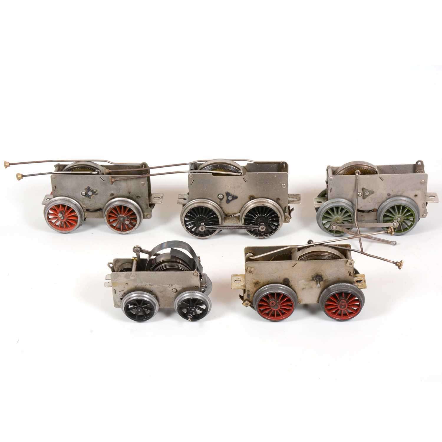Lot 12 - Six Hornby O gauge model railway clock-work motor chassis for locomotives, all loose.