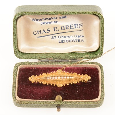 Lot 369 - A Victorian Etruscan style 15 carat gold bar brooch set with seed pearls, boxed