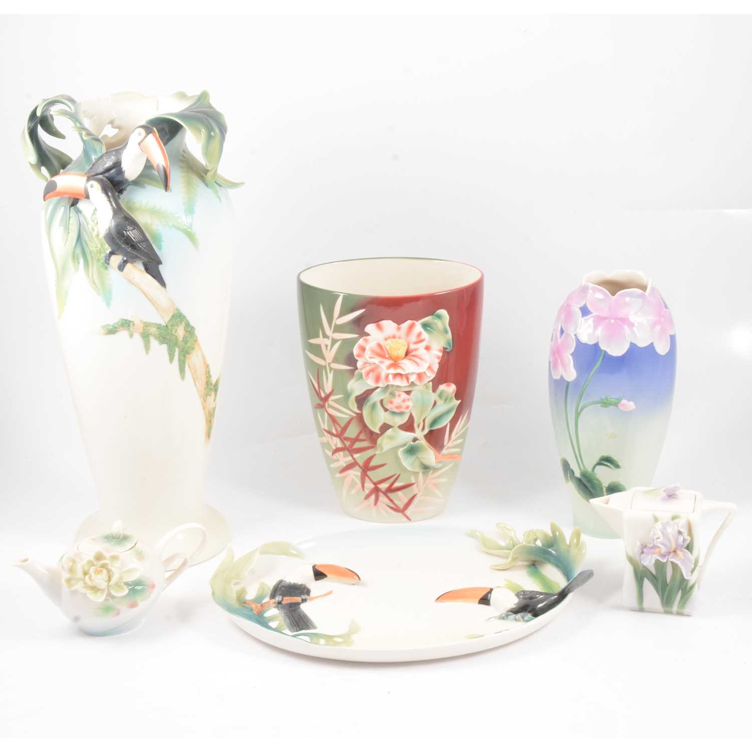 Lot 1 - Franz porcelain Tucan vase, dish and four floral pieces.