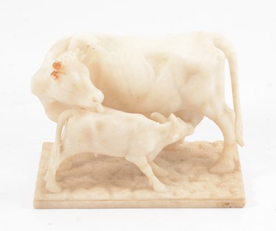 Lot 93 - European, carved alabaster sculpture of a cow and calf, early 20th century